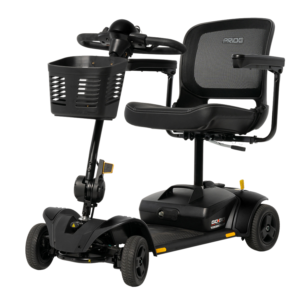 The Pride Mobility Go Go Elite Traveller® 2 Platinum Scooter is a black, three-wheeled scooter with EZ Turn technology, mesh backrest, armrests, front basket, and compact design—ideal for both indoor and outdoor use.